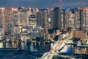 Illuminated Tsukiji Bridge and Harumi high-rise apartments