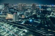 Urban night view of the waterfront area with Shinagawa Station train views
