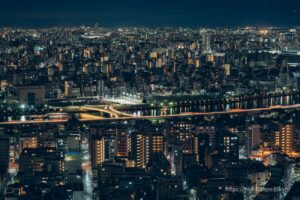 Sakura Bridge illuminated over the Sumida River.