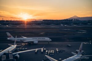 Passenger aircraft on the runway with the setting sun