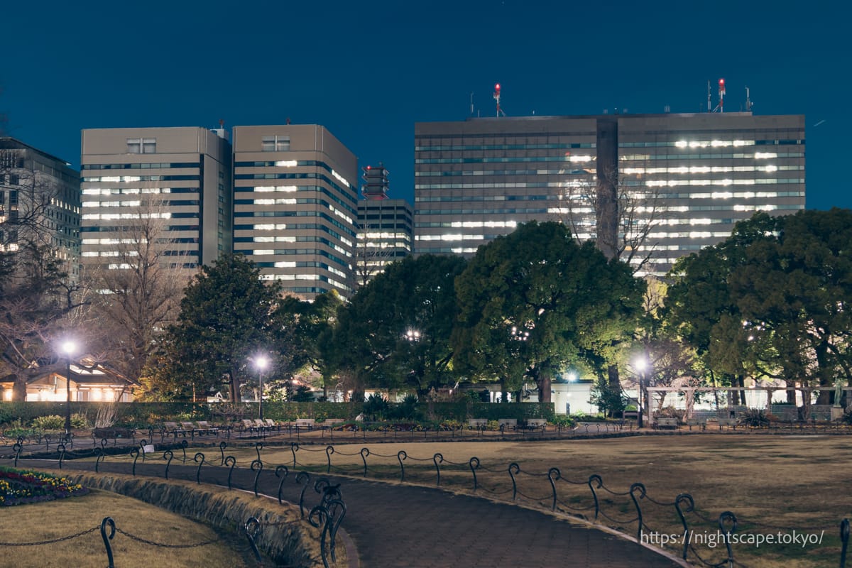Benches in Hibiya Park and the skyscrapers of Kasumigaseki