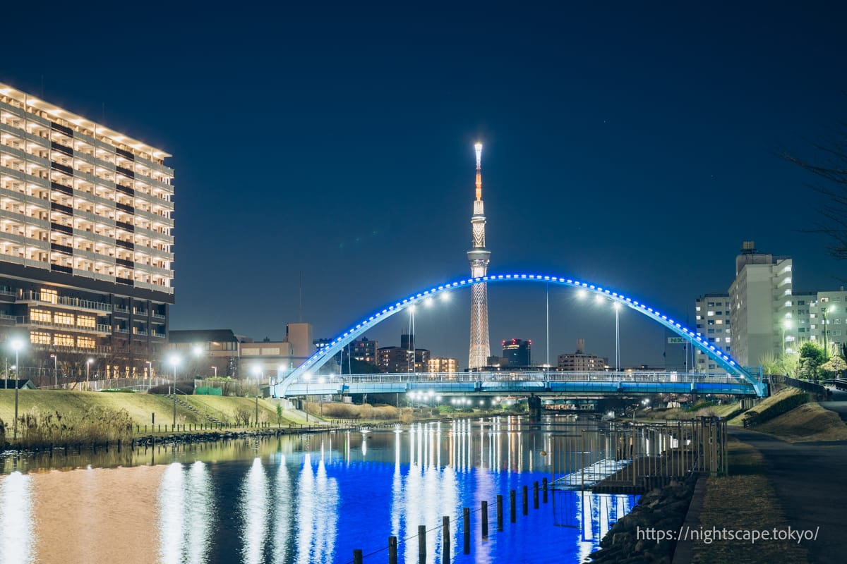 Illuminated Fureai Bridge and Tokyo Sky Tree.