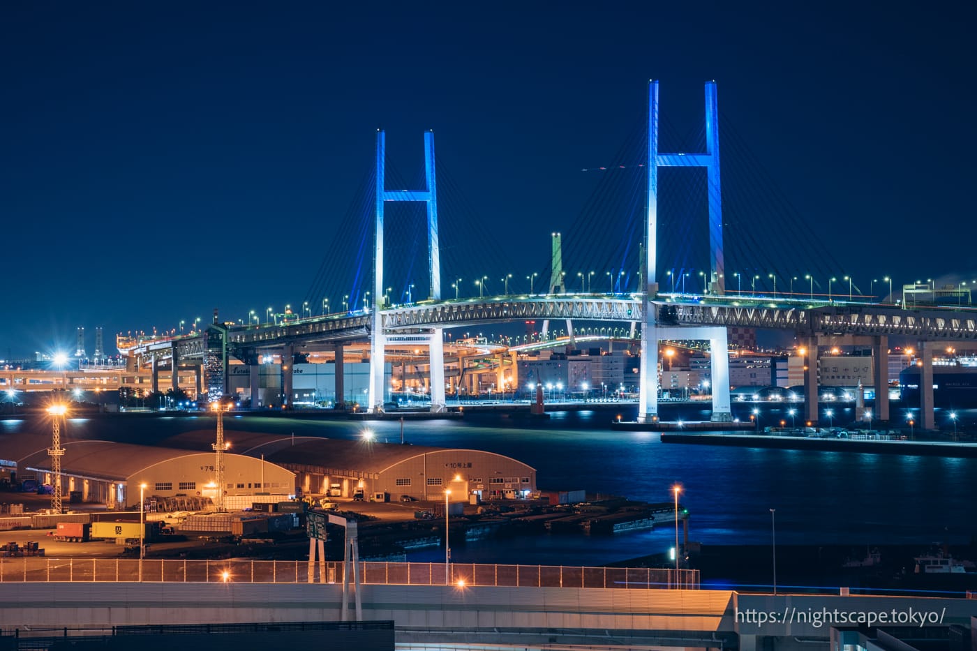Yokohama Bay Bridge lit up in blue 