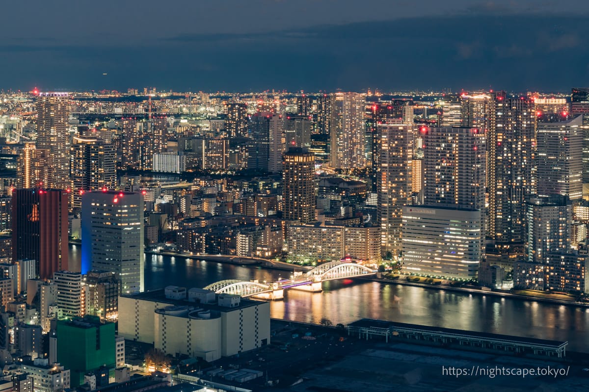 Illuminated Kachidoki Bridge and high-rise apartments in Harumi