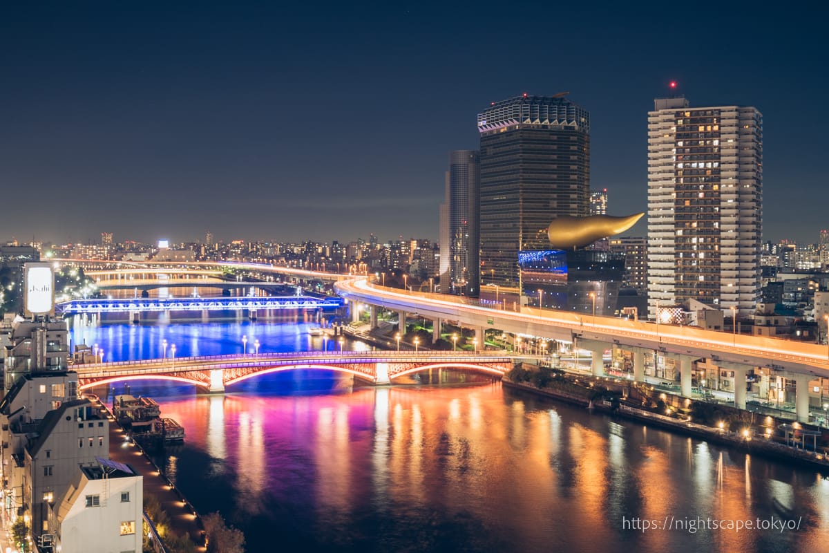 Azuma and Komagata bridges illuminated over the Sumida River